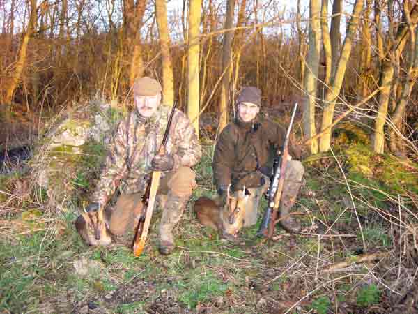 Two men with two culled Muntjac